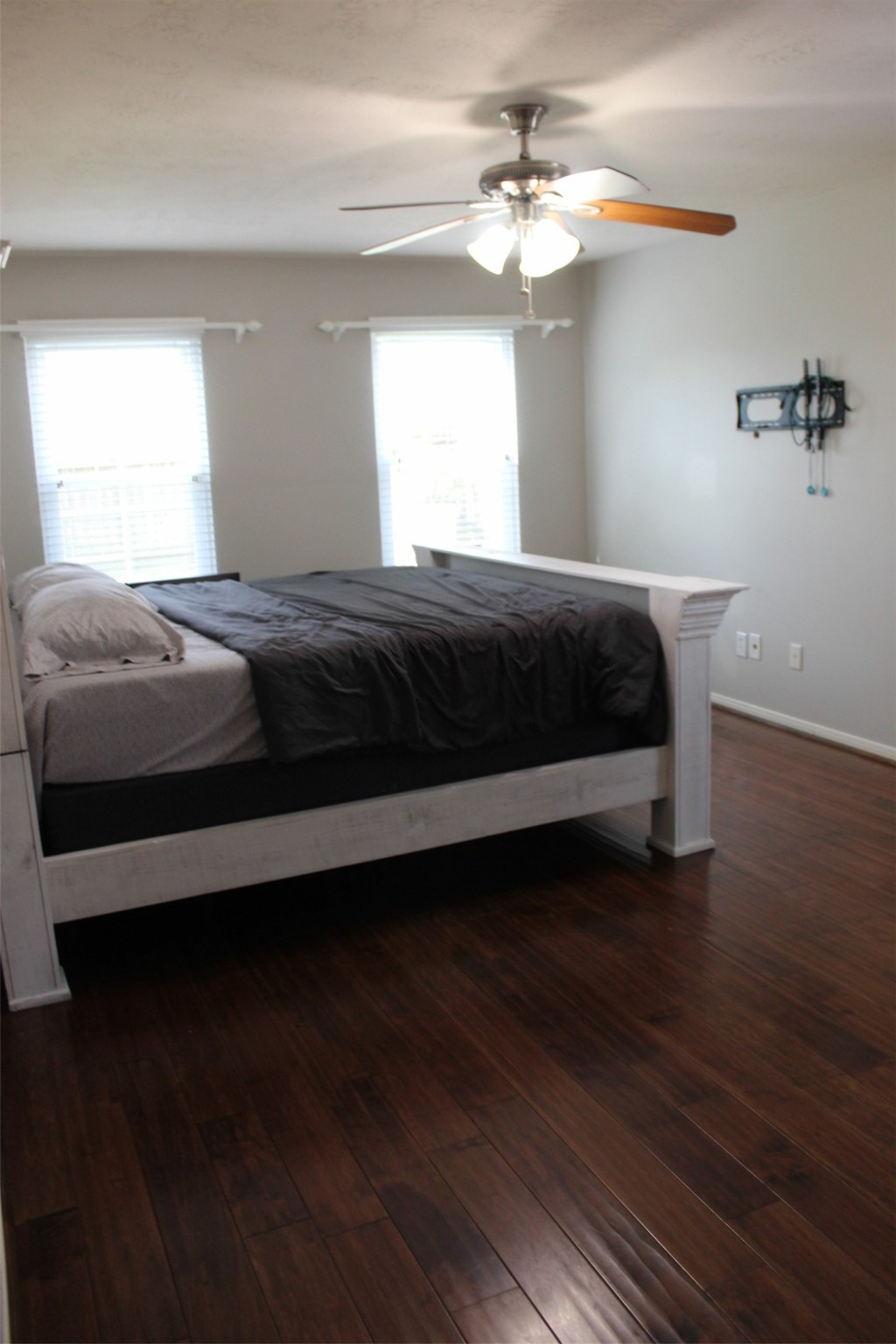 4507 Bridgestone Point Drive Spring, TX 77389 - Photo 8 of 21 a bedroom with a bed and a chandelier