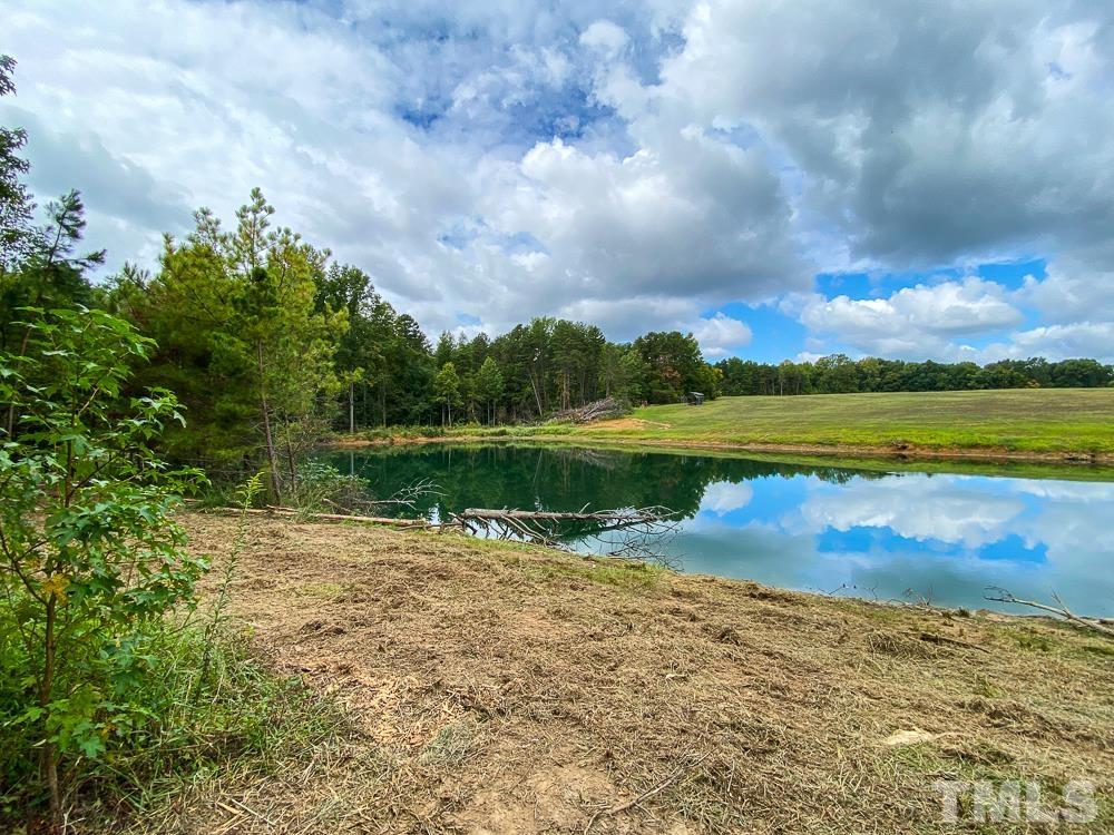 1 Country Club Road Roxboro, NC 27574 - Photo 5 of 29 a view of a lake with a big yard