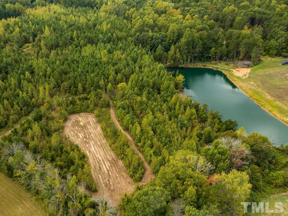 1 Country Club Road Roxboro, NC 27574 - Photo 9 of 29 a view of a lake with a yard