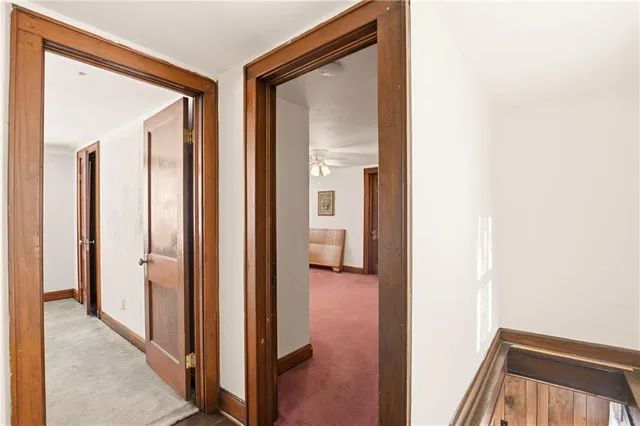 a view of a bathroom from a hallway