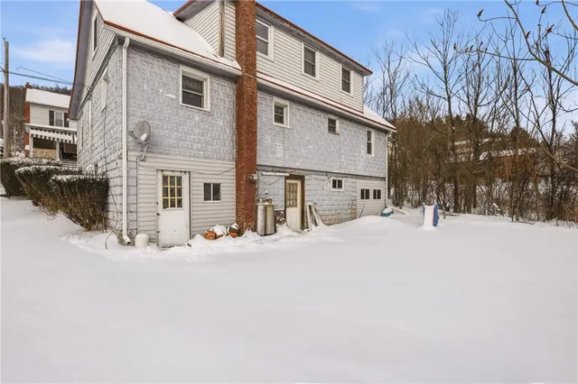 a view of street with large trees