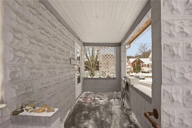 a bathroom with a bathtub and a window
