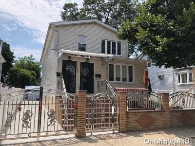 a front view of a house with iron fence