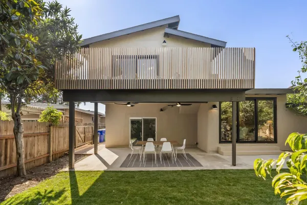 a view of a house with a yard porch and sitting area
