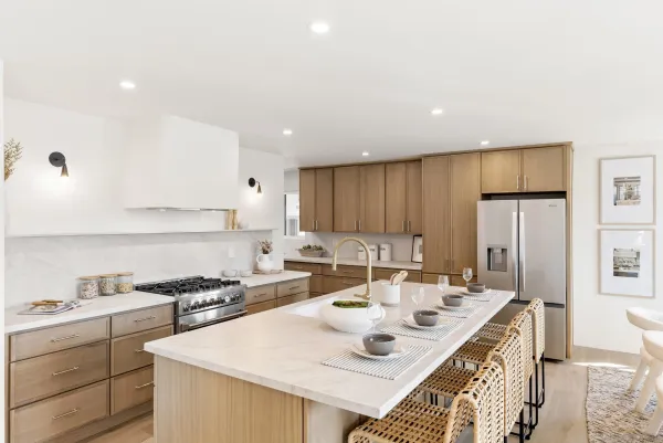 a kitchen with stainless steel appliances kitchen island granite countertop a sink and cabinets