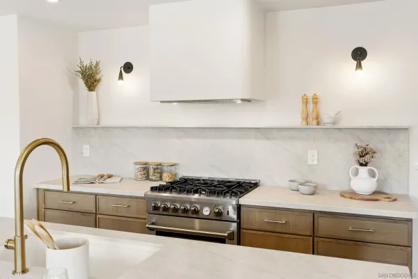a kitchen with a stove and cabinets