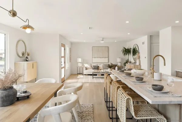 a kitchen with a sink appliances and cabinets