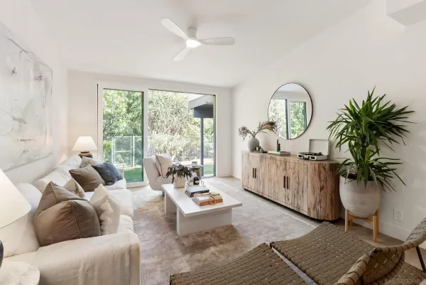 a living room with furniture and a large window