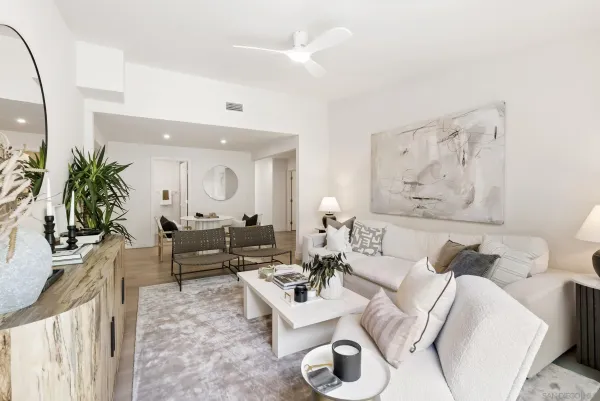 a living room with furniture and a large window