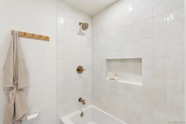 a bathroom with a tub and a shower
