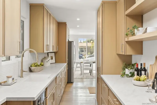 a kitchen with a sink stove and cabinets