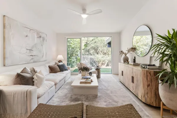 a living room with furniture and a large window