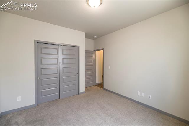 5126 Pring Ranch Road Colorado Springs, CO 80922 - Photo 19 of 32 Main-level bedroom