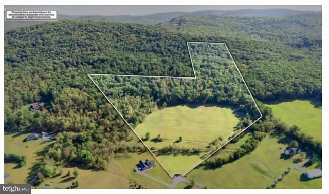 a view of a yard and mountain view