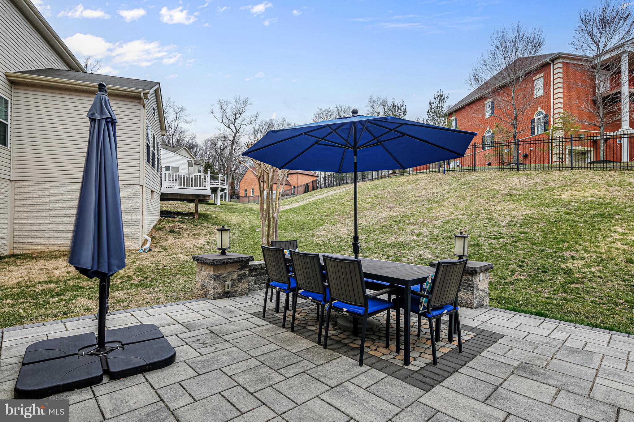 7145 Long View Road Columbia, MD 21044 - Photo 18 of 65 Spacious paver patio with accent lighting