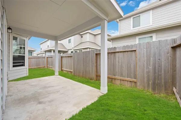 a view of a backyard of the house