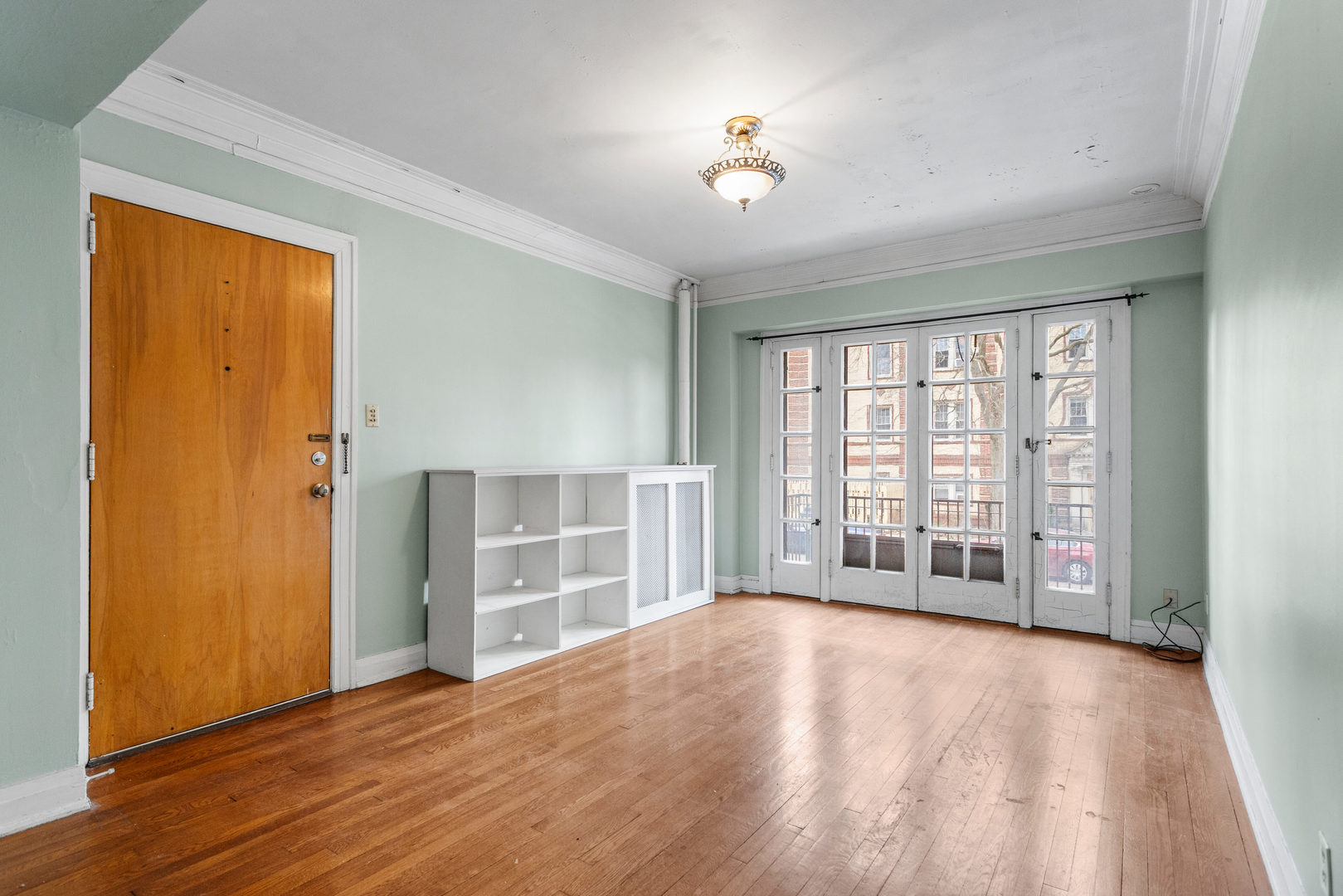 307 North Prairie Street, Unit 3 Champaign, IL 61820 - Photo 16 of 34 an empty room with wooden floor and windows