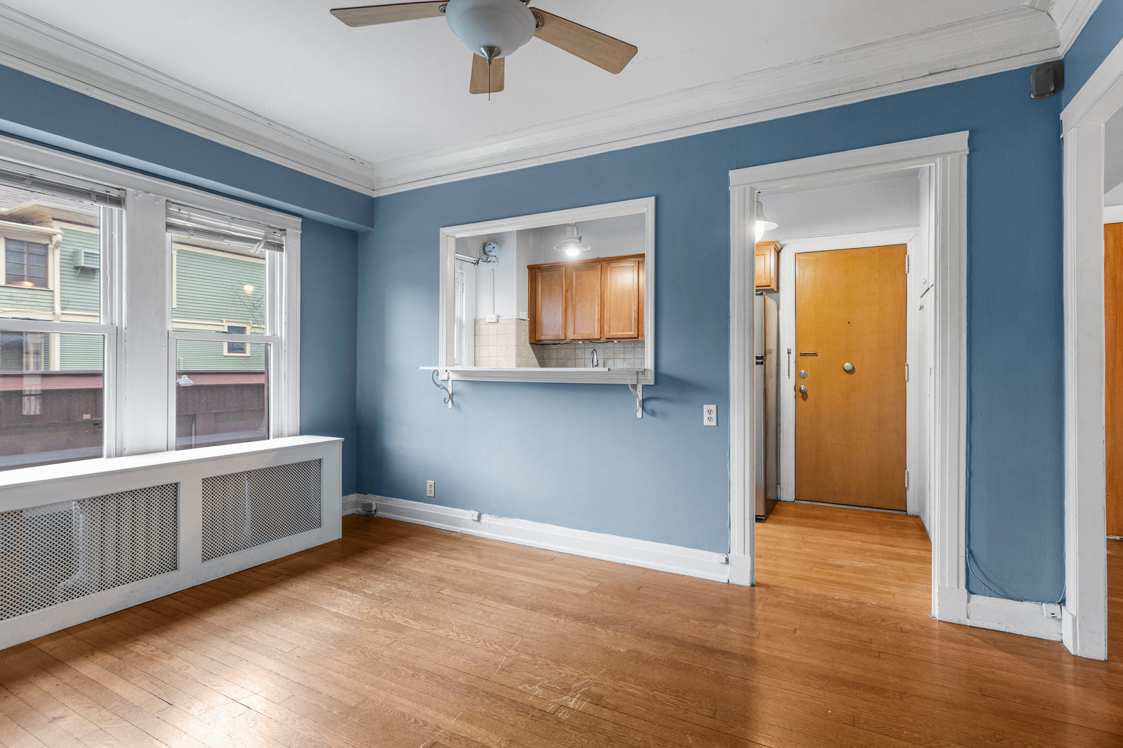 307 North Prairie Street, Unit 3 Champaign, IL 61820 - Photo 19 of 34 an empty room with wooden floor and windows