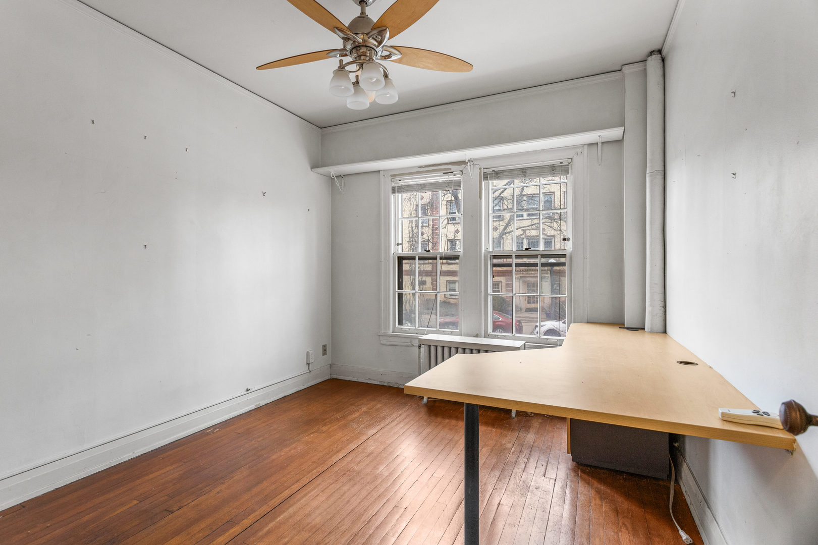 307 North Prairie Street, Unit 3 Champaign, IL 61820 - Photo 25 of 34 a view of a room with wooden floor and windows