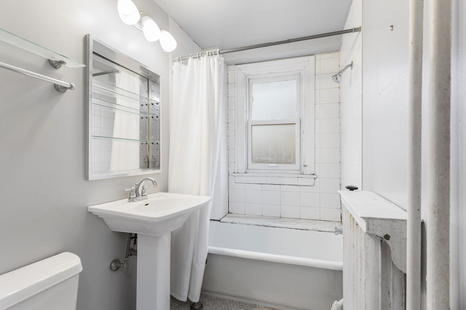 307 North Prairie Street, Unit 3 Champaign, IL 61820 - Photo 27 of 34 a bathroom with a sink a toilet and shower