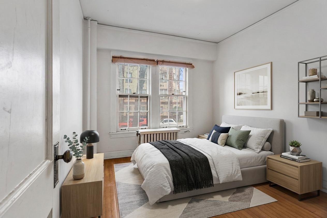 307 North Prairie Street, Unit 3 Champaign, IL 61820 - Photo 5 of 34 a bedroom with a bed and windows