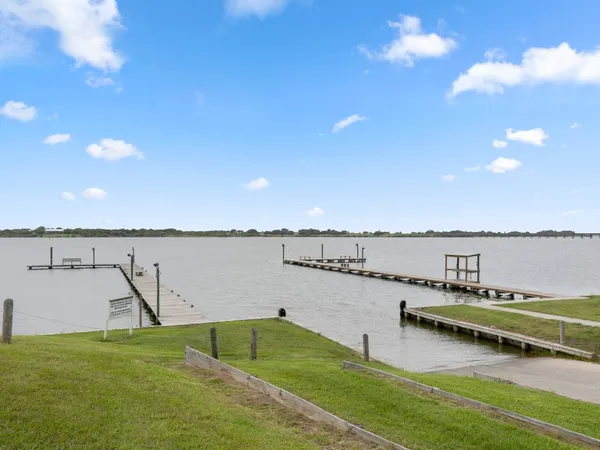 a view of a lake with a yard