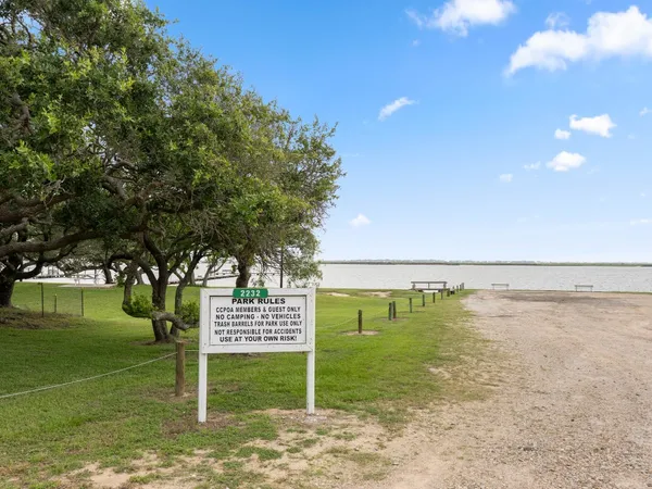 a view of a golf course with a lake view