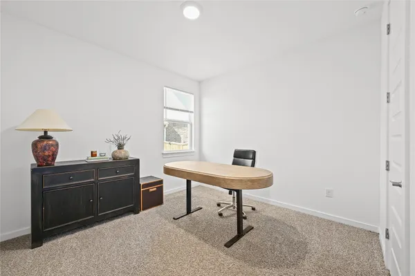 a view of a workspace with furniture