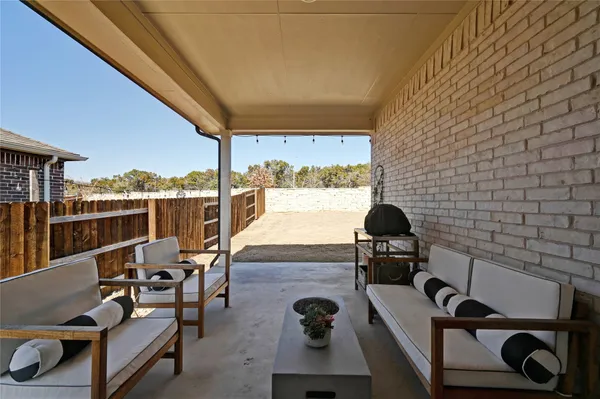 a view of a balcony with chairs