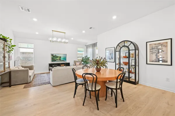 a view of a dining room with furniture and window