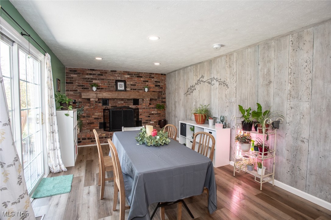 730 Brookledge Drive Medina, OH 44256 - Photo 14 of 43 Rustic mantel, and brick wall that has a modern farmhouse charm.