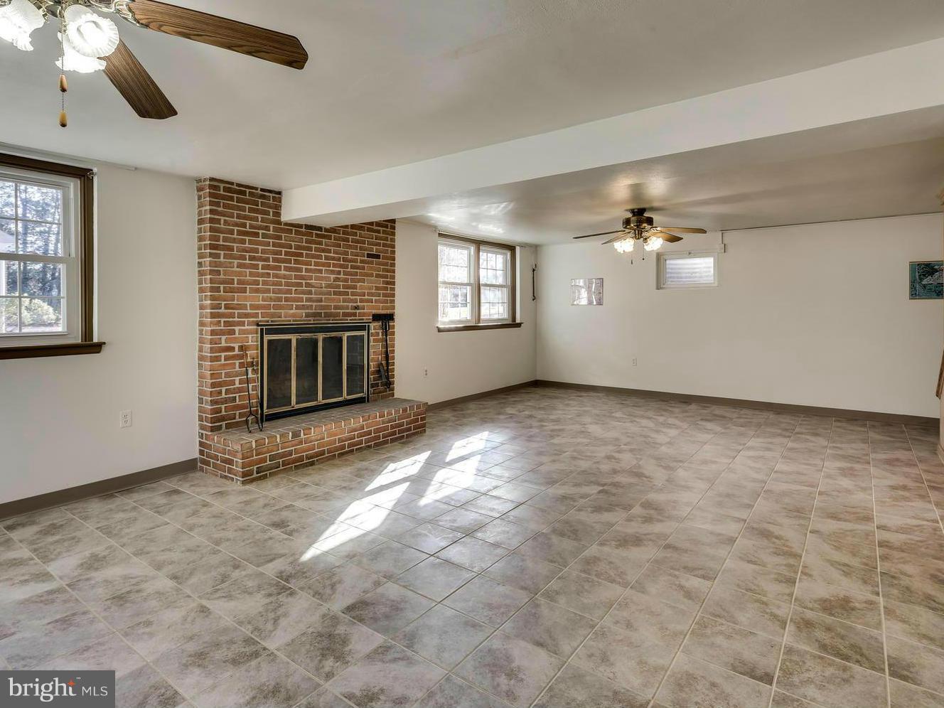 3909 Chatham Road Ellicott City, MD 21042 - Photo 23 of 30 Basement with Relaxing Fireplace
