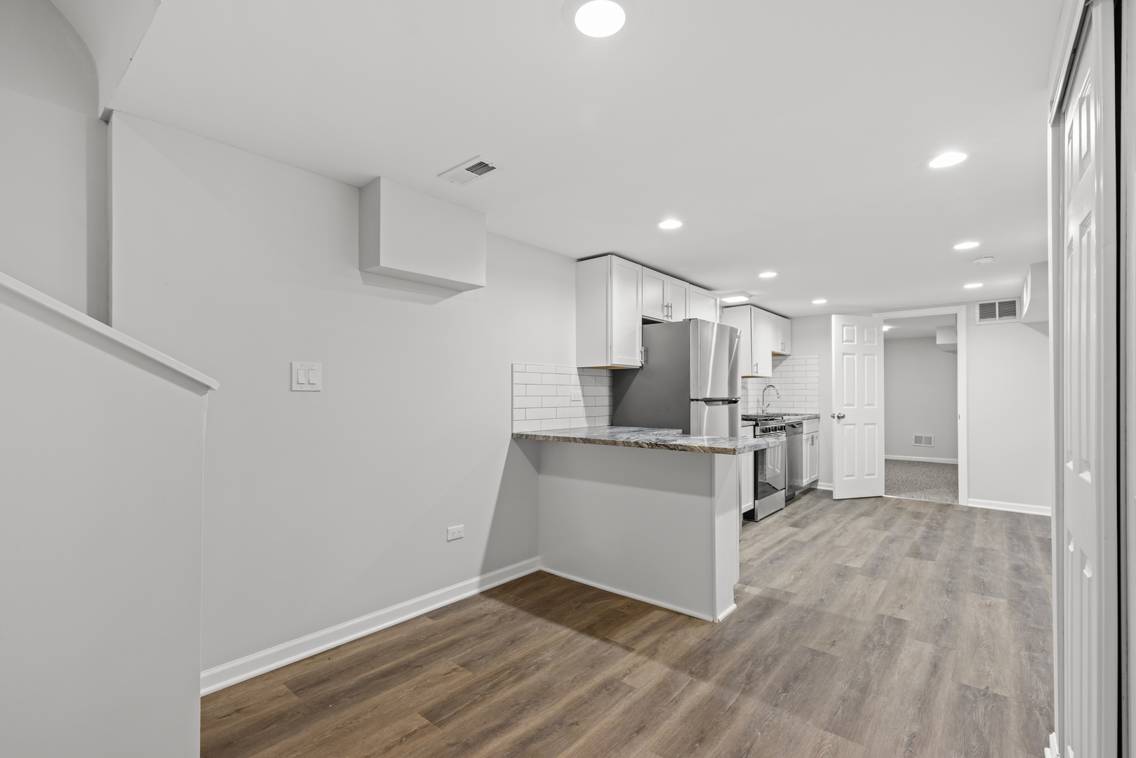 236 Callan Avenue, Unit G Evanston, IL 60202 - Photo 6 of 13 a view of kitchen with wooden floor
