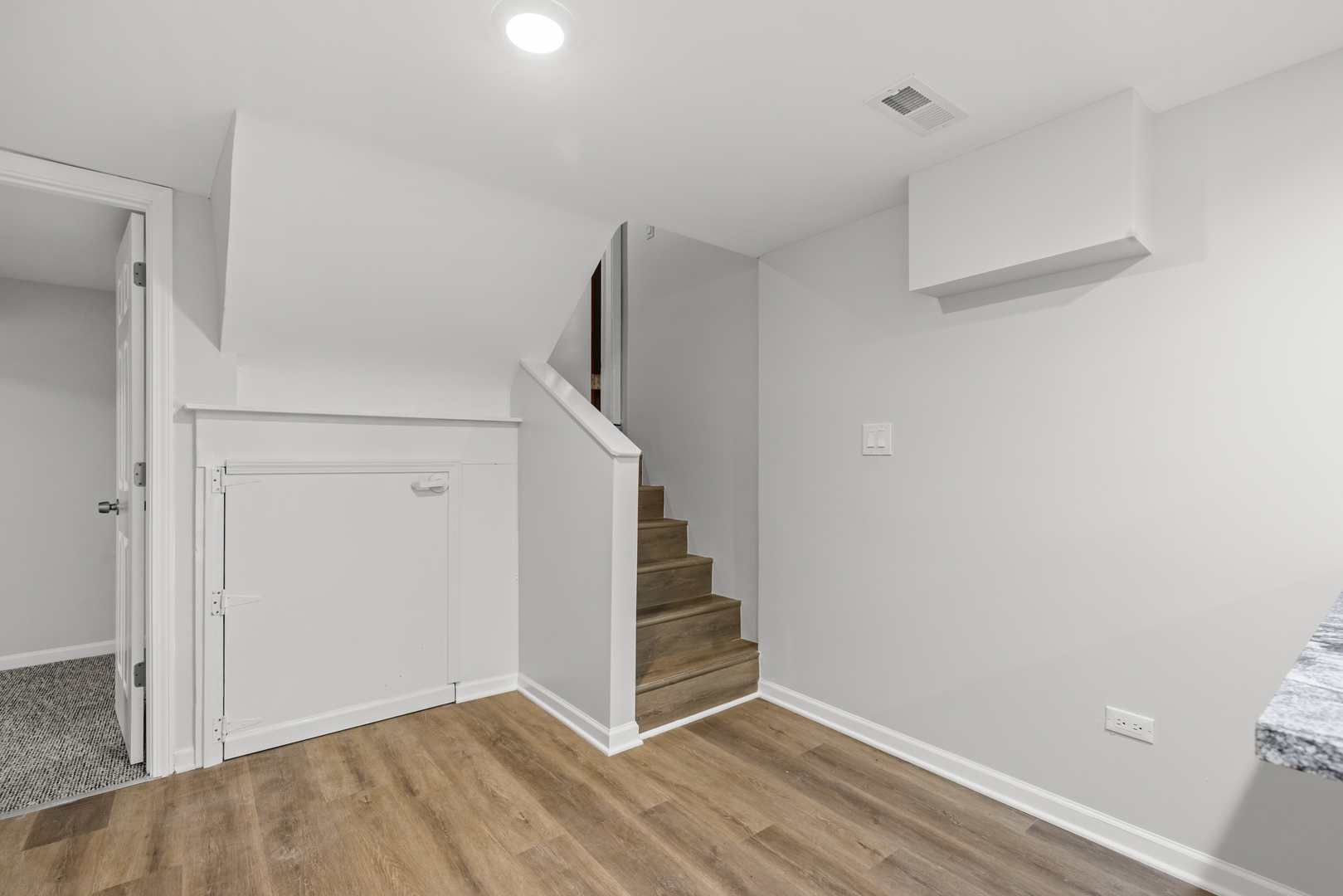 236 Callan Avenue, Unit G Evanston, IL 60202 - Photo 8 of 13 a view of an empty room with wooden floor and closet