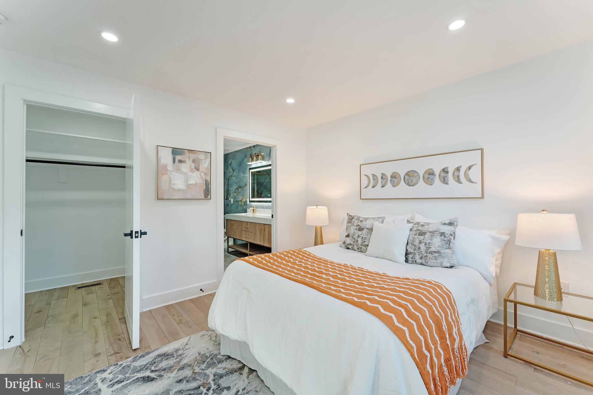 3009 13th Street Northwest, Unit 2 Washington, DC 20009 - Photo 20 of 44 a bedroom with a bed and a painting on the wall
