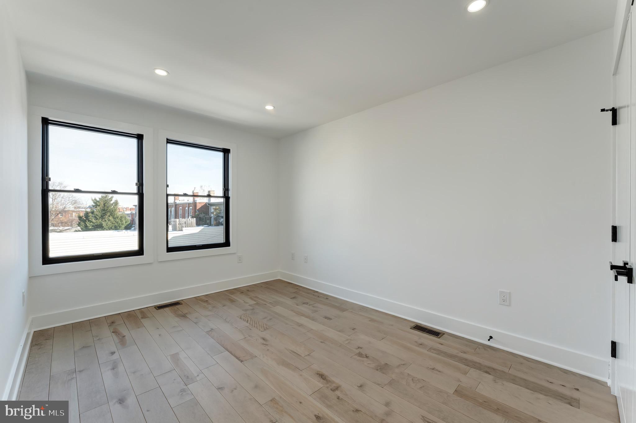 3009 13th Street Northwest, Unit 2 Washington, DC 20009 - Photo 24 of 44 wooden floor in an empty room with a window