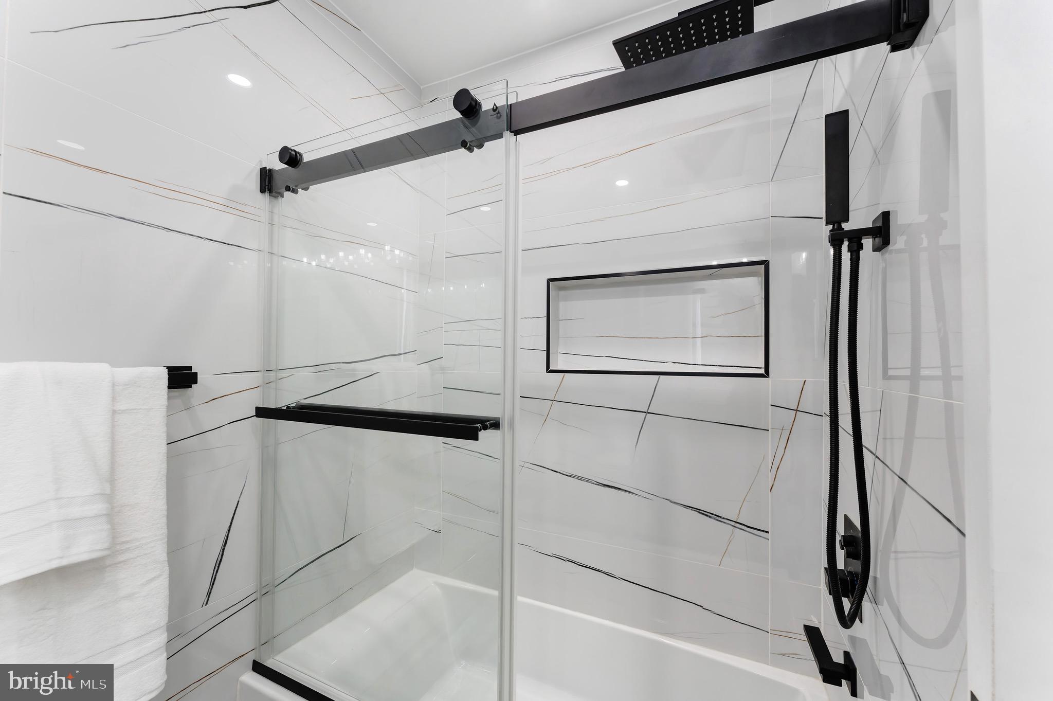 3009 13th Street Northwest, Unit 2 Washington, DC 20009 - Photo 27 of 44 a bathroom with a shower and mirror