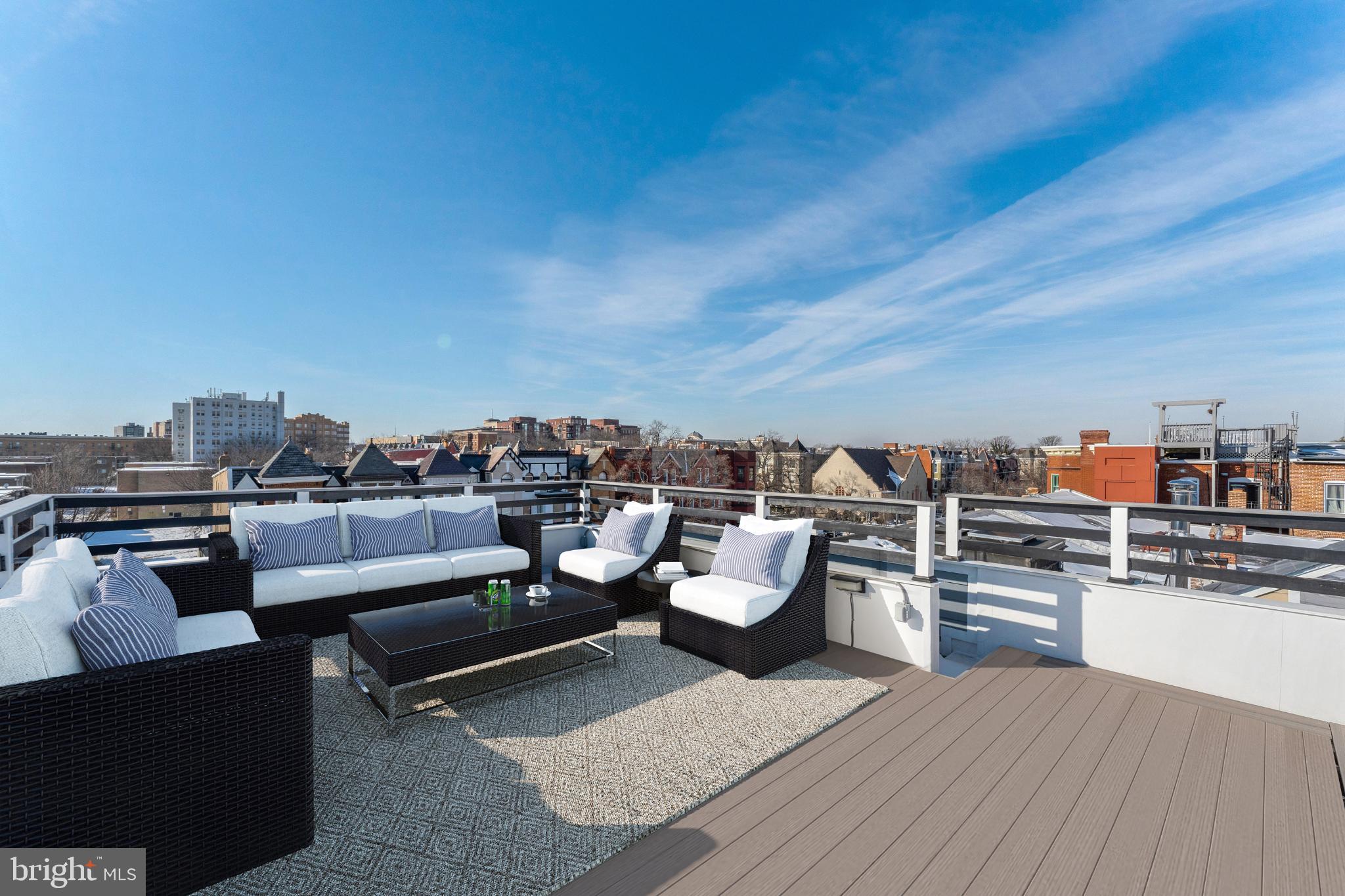 3009 13th Street Northwest, Unit 2 Washington, DC 20009 - Photo 38 of 44 a roof deck with a couch and chairs