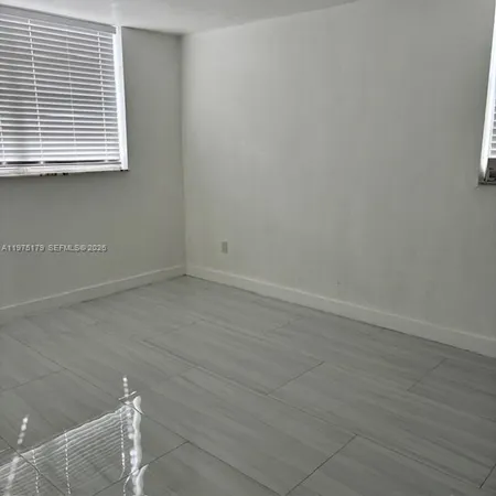 a view of a room that has window in it