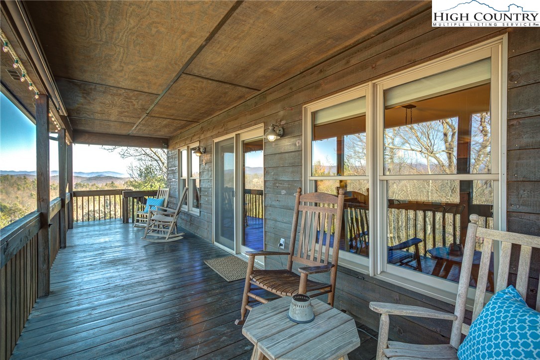 1643 Buck Mountain Road Purlear, NC 28665 - Photo 14 of 33 a living room with furniture and a floor to ceiling window