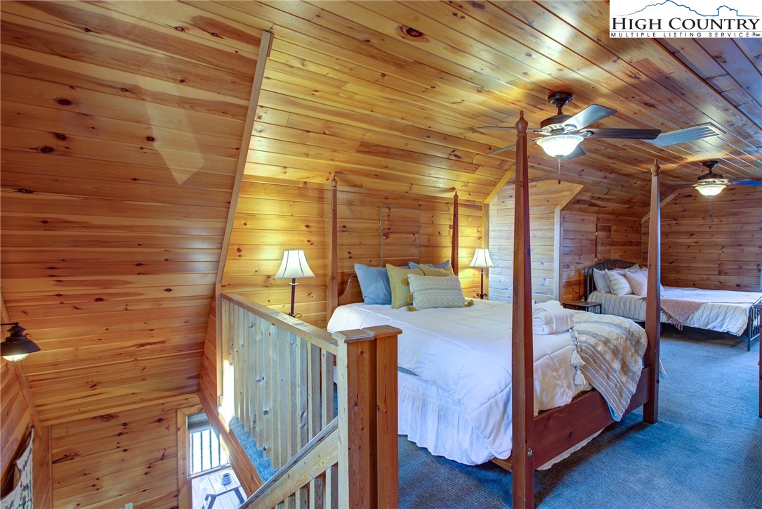 1643 Buck Mountain Road Purlear, NC 28665 - Photo 15 of 33 a bedroom with bed and a window