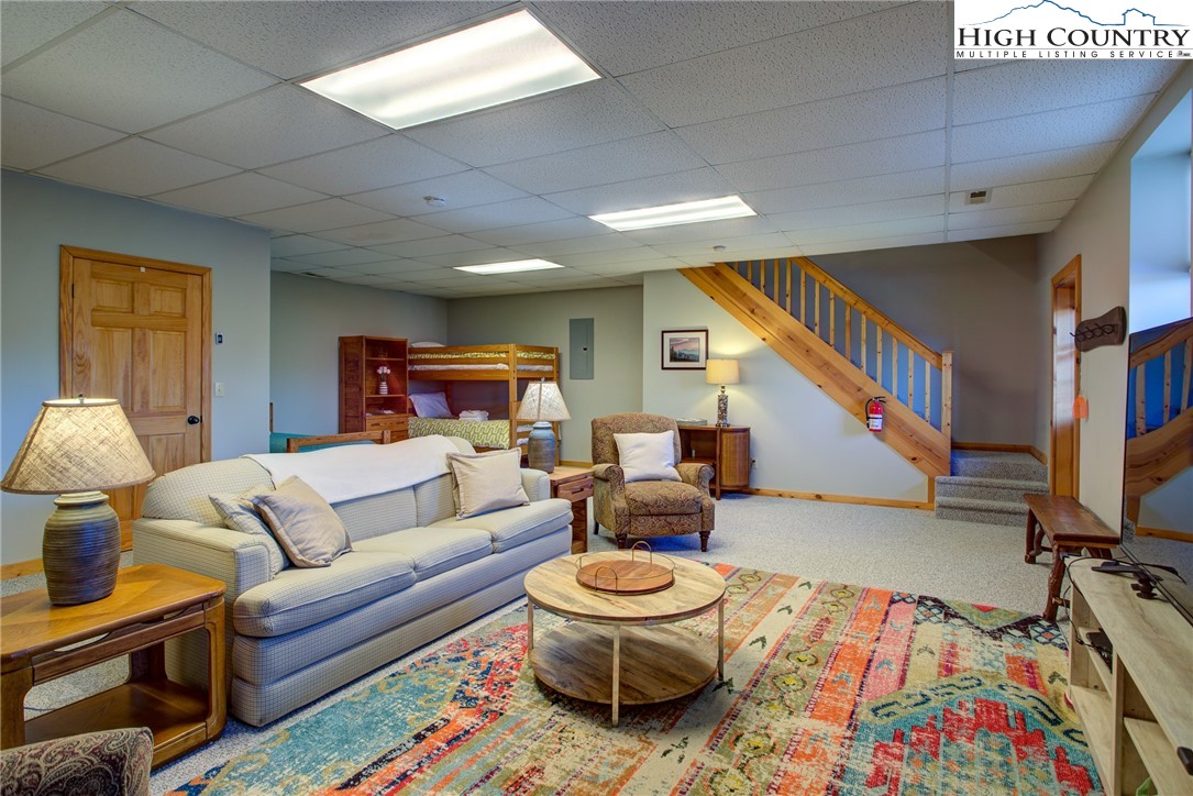 1643 Buck Mountain Road Purlear, NC 28665 - Photo 21 of 33 a living room with furniture and a wooden floor