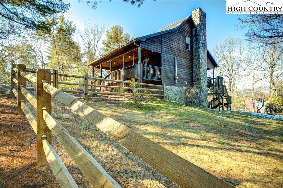 1643 Buck Mountain Road Purlear, NC 28665 - Photo 25 of 33 a view of a house with a yard