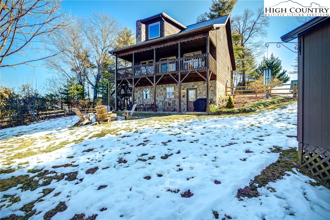 1643 Buck Mountain Road Purlear, NC 28665 - Photo 29 of 33 a view of a house with a yard