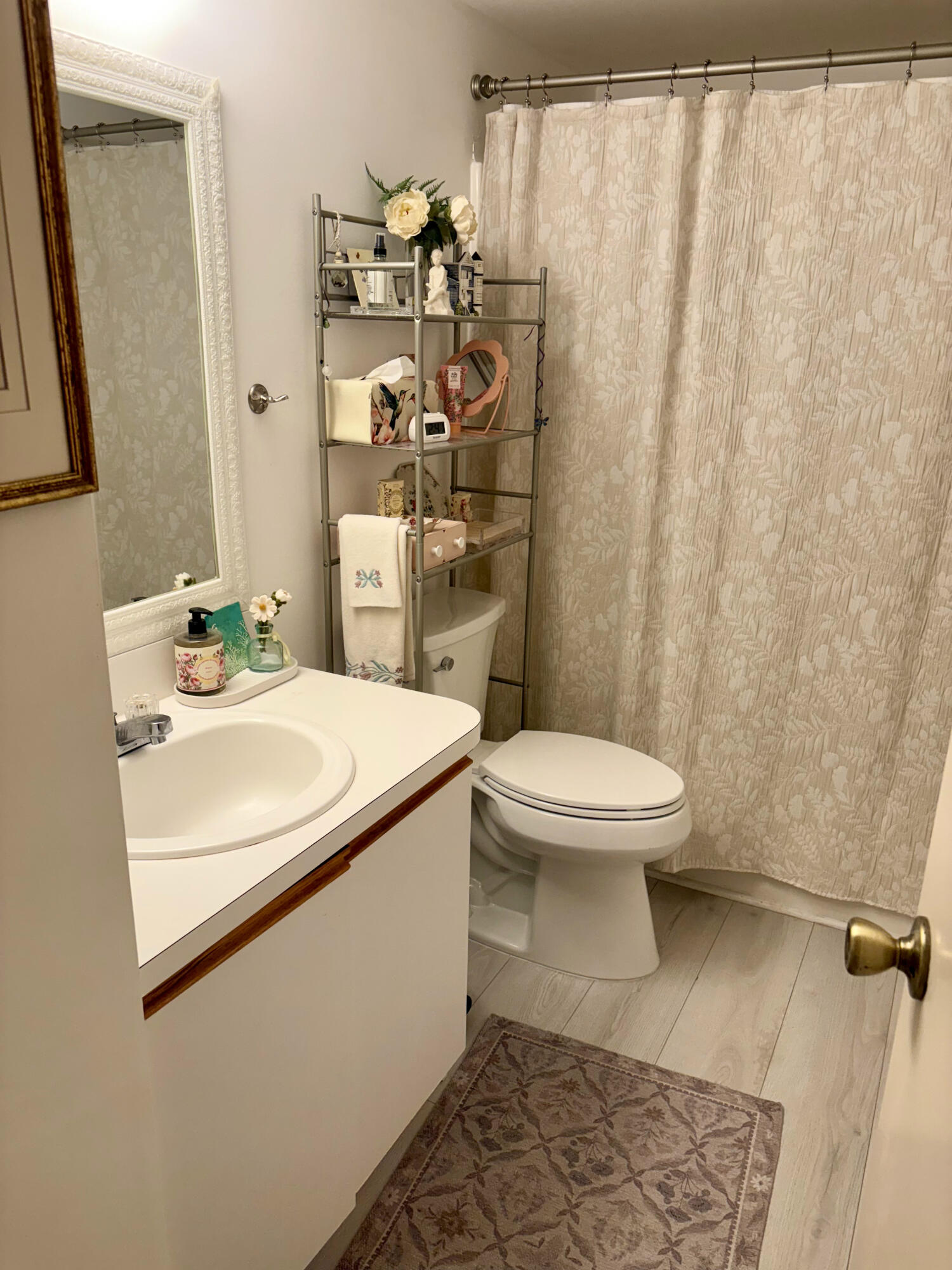 540 Southwest South River Drive, Unit 204 Stuart, FL 34997 - Photo 9 of 14 a bathroom with a sink toilet and shower