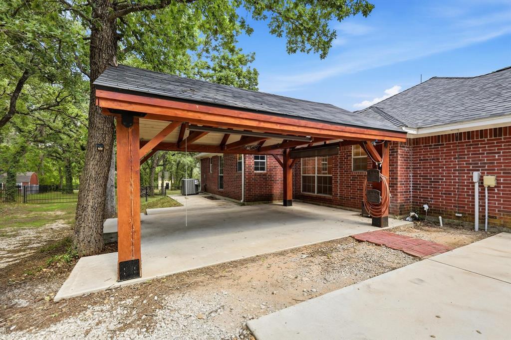 289 County Road 1170 Decatur, TX 76234 - Photo 31 of 40 Oversized custom built outdoor living with ceiling fan.