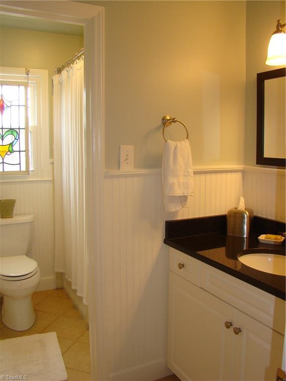 3614 Pinetop Road Greensboro, NC 27410 - Photo 18 of 30 Updated second upper level bath. Shower and toilet separated from the sink/vanity area so two people can get ready at the same time!