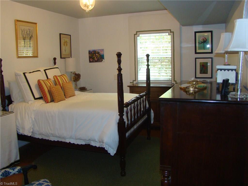 3614 Pinetop Road Greensboro, NC 27410 - Photo 19 of 30 Fourth bedroom is located on the lower level. A full bath is across the hall, with the laundry room just beyond.