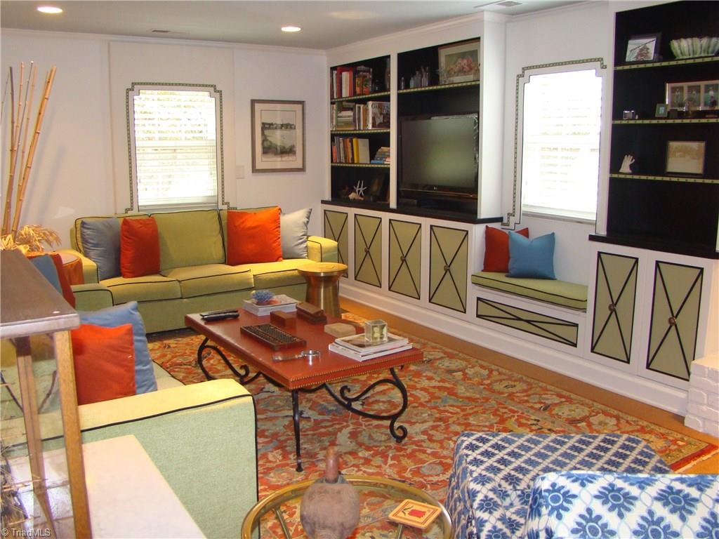 3614 Pinetop Road Greensboro, NC 27410 - Photo 21 of 30 Handpainted built in bookcases with cabinets and window bench seating.