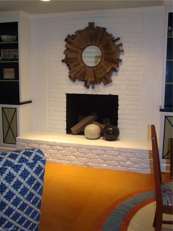 3614 Pinetop Road Greensboro, NC 27410 - Photo 22 of 30 Painted brick wood-burning fireplace.
